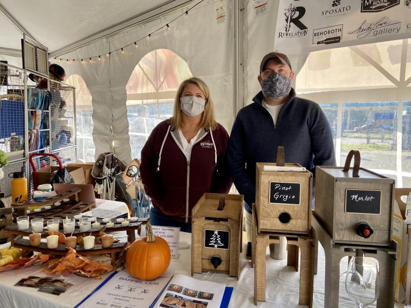 Katie Callahan and Andrew Fleming of Cooperage Cabinets served up wine along with offering custom-made cabinets made from wine and whiskey barrels.